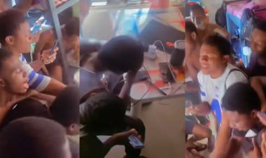 Fellow students gather to console friend, shout, and shed tears on his behalf as his girlfriend dumps him