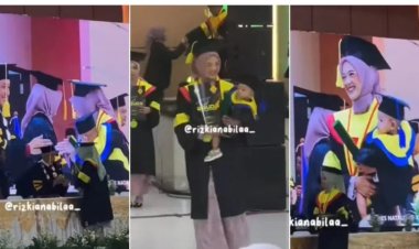 Heartwarming Moment as Mother Carries Baby Across Graduation Stage, Combining Parenthood with Academic Triumph